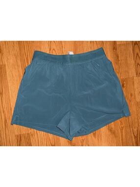 Halara women’s pull on active shorts blue new in bag XS zip pockets 2” inseam